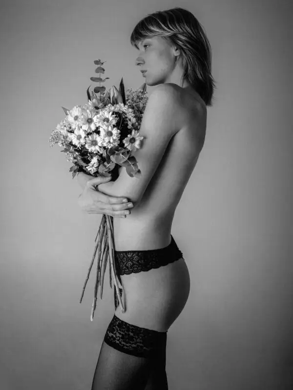 Black and white portrait of a woman in sensual lingerie, radiating power, confidence, and fine art elegance