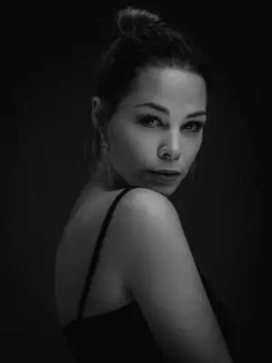 Bold black and white fine art portrait of a woman in solitude, capturing emotional depth, stillness, and quiet strength