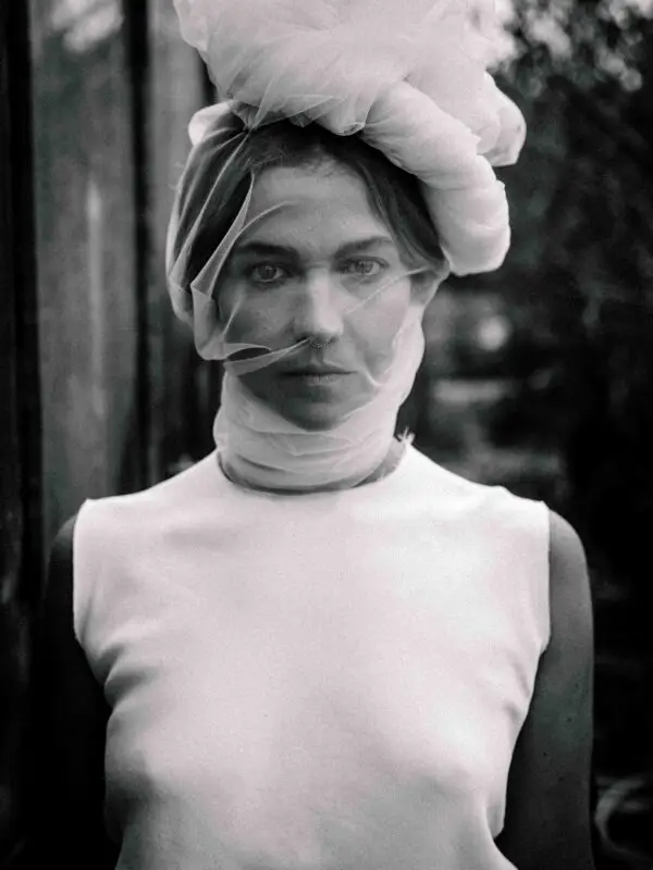 Fine art black and white portrait of a veiled woman exuding cold grace, poetic detachment, and emotional silence – Fade Veil