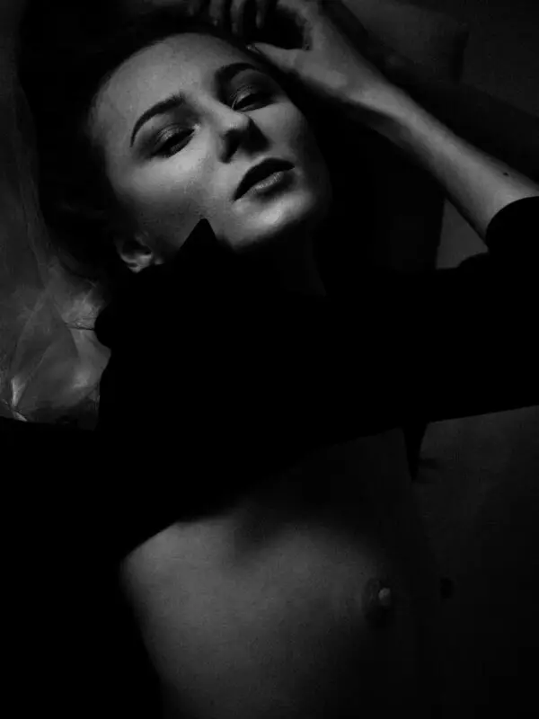 Erotic fine art photography in black and white capturing raw intimacy, defiant emotion, and sensual stillness – How Dare You