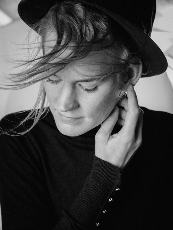 Black and White Portrait with Wind and Hat